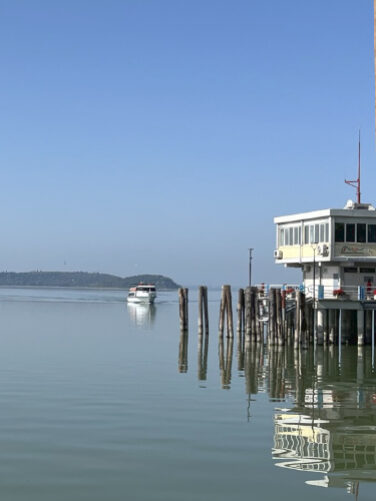 Indulge in the tranquility of a scenic boat ride to Isola Maggiore, a charming and secluded island in Lake Trasimeno, Italy. Immerse yourself in the serene beauty of the lake, discover the island's unique atmosphere, and savor the picturesque views as you approach this hidden gem.